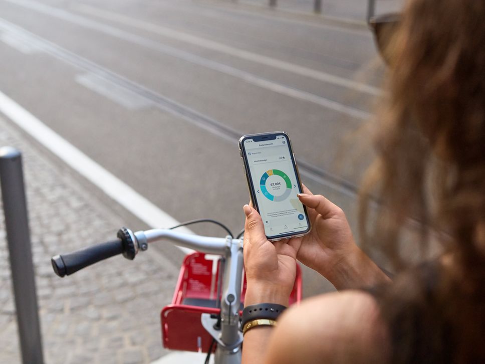 A woman looks at her smartphone