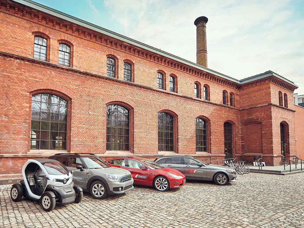 Vehicle fleet in front of building