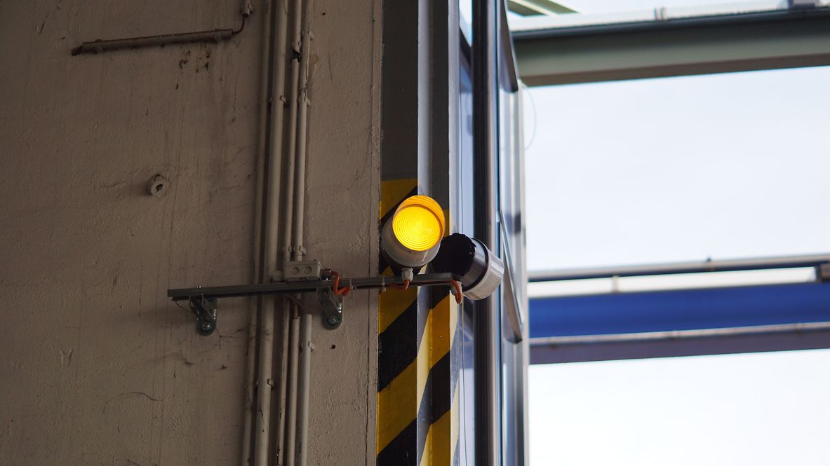 An industrial door with a signal indicating automatic closure